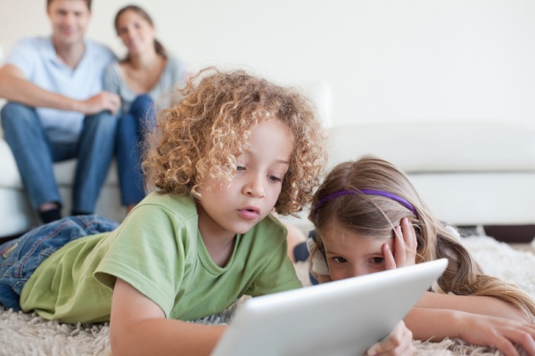 Young children using a tablet